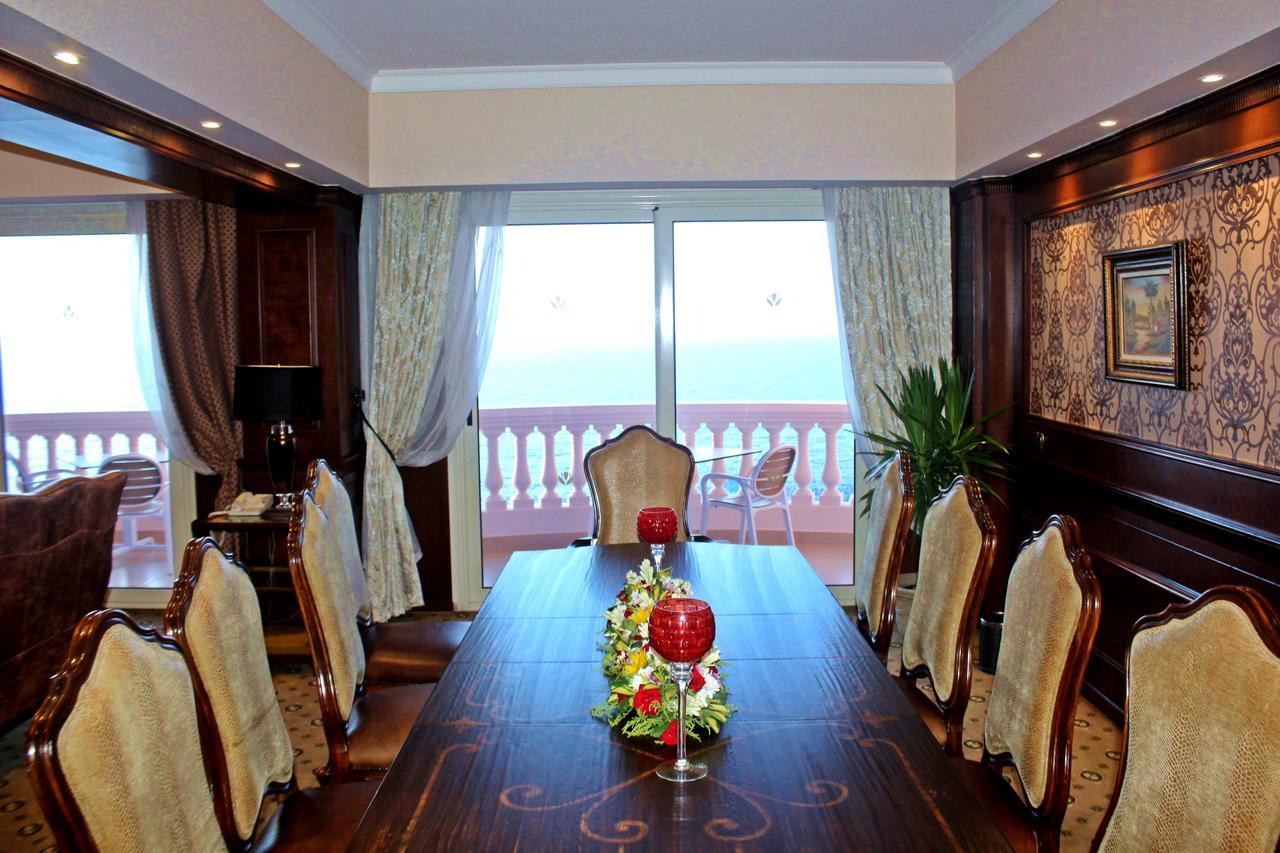 Tolip Hotel Alexandria Exterior foto The dining room of a suite